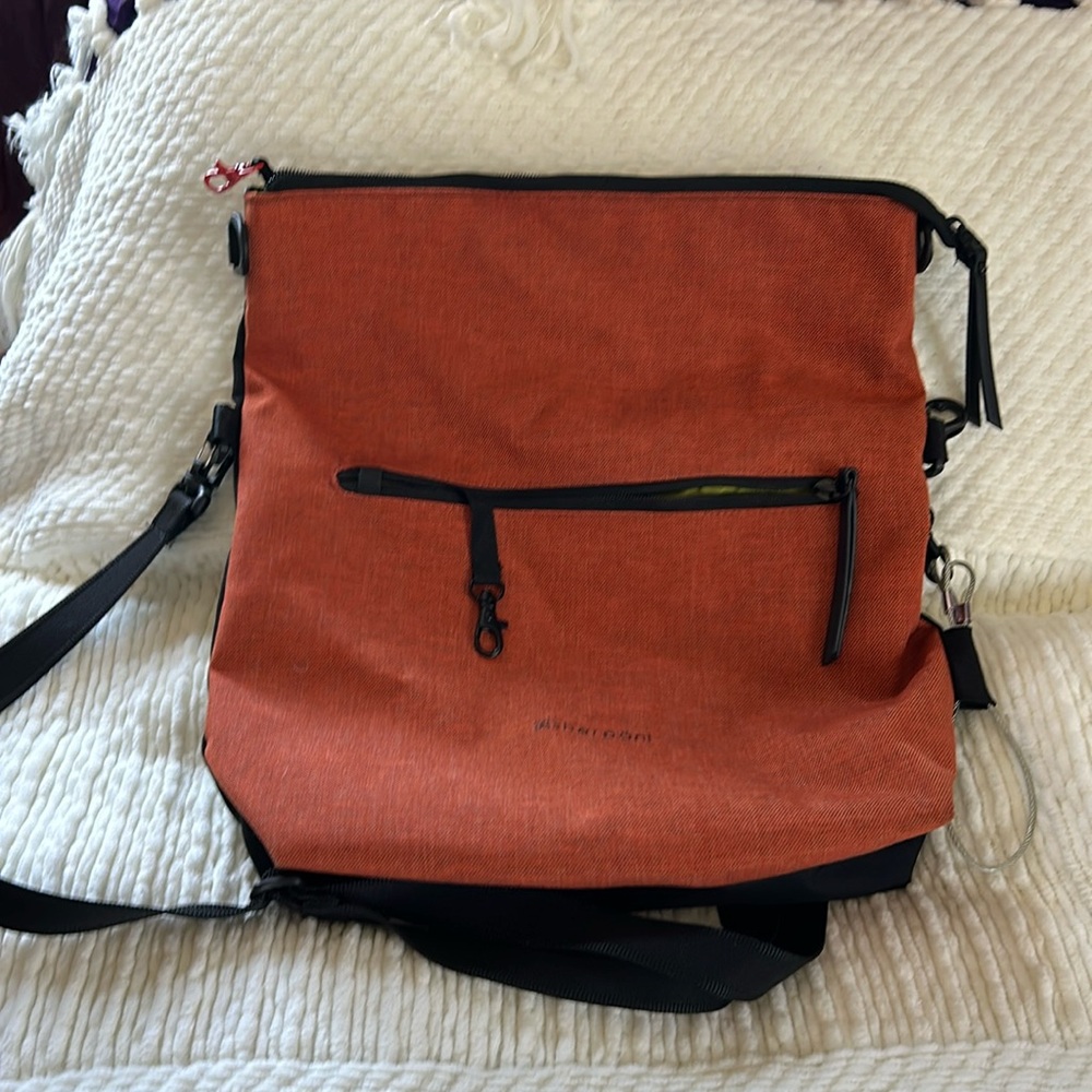 Sherpani adjustable shoulder/crossbody bag.